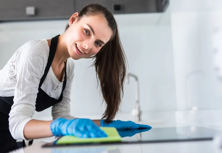 beautiful-woman-doing-housework-while-cleaning-kitchen.jpg